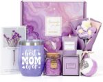 A purple gift box with a 12 oz. "Best Mom Ever" tumbler, knitted flower, heart soap, bath bomb, bath salt, and candle.
