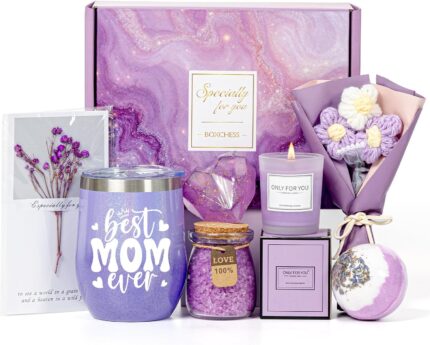 A purple gift box with a 12 oz. "Best Mom Ever" tumbler, knitted flower, heart soap, bath bomb, bath salt, and candle.