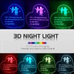 Heart-shaped 3D lamp with a child running to a mother, glowing with multicolor LED light on a dark background.