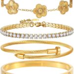 Close-up of four GIVCHO 18K gold plated stainless steel bangle bracelets with clear cubic zirconia stones.