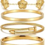 Two ISELBDR 18K gold plated stainless steel bangles, one with a clover design and one with a nail design, stacked together.