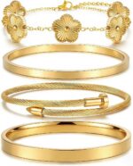 Two ISELBDR 18K gold plated stainless steel bangles, one with a clover design and one with a nail design, stacked together.