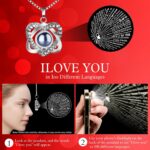 A red preserved rose in a gift box with a heart-shaped pendant necklace, illuminated by warm lights.