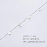 Close-up of a 14K gold plated 'Mama' pendant necklace on a delicate cable chain, with a glossy finish.