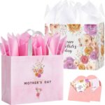 Two large pink floral gift bags with handles, tissue paper, greeting cards, and stickers for Mother's Day gifts.