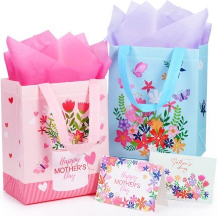 Two SUNCOLOR gift bags, one pink and one blue, with floral and butterfly designs, shown with tissue paper.