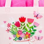 Two SUNCOLOR gift bags, one pink and one blue, with floral and butterfly designs, shown with tissue paper.