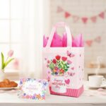 Two SUNCOLOR gift bags, one pink and one blue, with floral and butterfly designs, shown with tissue paper.