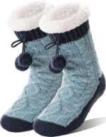 Pair of Welwoos women's fuzzy thermal fleece slipper socks in Balls-blue with non-slip grips on a wooden floor.