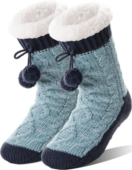 Pair of Welwoos women's fuzzy thermal fleece slipper socks in Balls-blue with non-slip grips on a wooden floor.