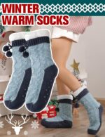 Pair of Welwoos women's fuzzy thermal fleece slipper socks in Balls-blue with non-slip grips on a wooden floor.