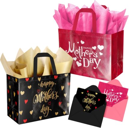 Two ysmile Mother's Day gift bags, one pink with hearts and one black with gold details, with tissue paper and cards.